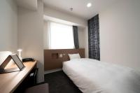Washington R&B Hotel Nagoya Ekimae客房内的一张或多张床位