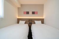 Washington R&B Hotel Nagoya Ekimae客房内的一张或多张床位