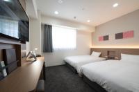 Washington R&B Hotel Nagoya Ekimae客房内的一张或多张床位