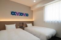Washington R&B Hotel Nagoya Ekimae客房内的一张或多张床位