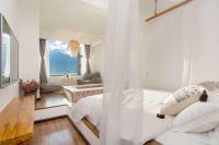 Aishe Honeymoon Erhai Lake Sea View Guesthouse客房内的一张或多张床位