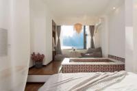 Aishe Honeymoon Erhai Lake Sea View Guesthouse客房内的一张或多张床位