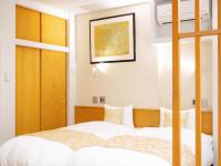 Tanakaya Kyoto Karasuma客房内的一张或多张床位