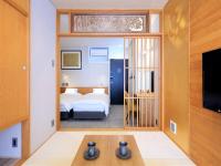 Tanakaya Kyoto Karasuma客房内的一张或多张床位
