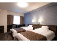 Sakura Shimanami Hotel客房内的一张或多张床位