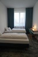 Stary Koszalin Hostel &amp; Hotel Services客房内的一张或多张床位