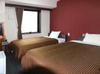 Hotel Trend Suzuka客房内的一张或多张床位