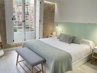 Loft de lujo en pleno corazón de Ourense客房内的一张或多张床位