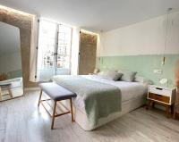 Loft de lujo en pleno corazón de Ourense客房内的一张或多张床位