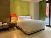 Ramada Encore By Wyndham Hualien客房内的一张或多张床位