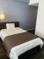 Sakura Shimanami Hotel客房内的一张或多张床位