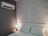 SRITEL BOUTIQUE HOTEL客房内的一张或多张床位