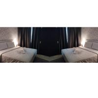 SRITEL BOUTIQUE HOTEL客房内的一张或多张床位