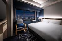 remm plus Kobe Sannomiya客房内的一张或多张床位