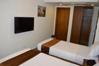Royal Inn Residence客房内的一张或多张床位