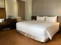 Ramada Encore By Wyndham Hualien客房内的一张或多张床位