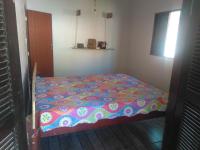 Casa de temporada Lindas Cachoeiras 10客房内的一张或多张床位