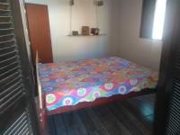 Casa de temporada Lindas Cachoeiras 10客房内的一张或多张床位