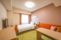 Tabino Hotel lit Matsumoto Milky white Onsen的电视和/或娱乐中心