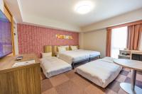 Tabino Hotel lit Matsumoto Milky white Onsen客房内的一张或多张床位