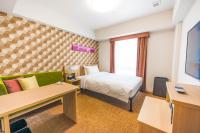 Tabino Hotel lit Matsumoto Milky white Onsen客房内的一张或多张床位