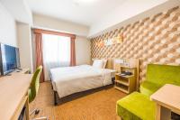Tabino Hotel lit Matsumoto Milky white Onsen的电视和/或娱乐中心