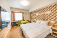 Tabino Hotel lit Matsumoto Milky white Onsen客房内的一张或多张床位