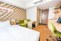 Tabino Hotel lit Matsumoto Milky white Onsen客房内的一张或多张床位