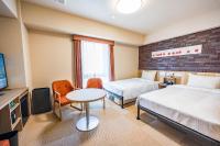 Tabino Hotel lit Matsumoto Milky white Onsen客房内的一张或多张床位
