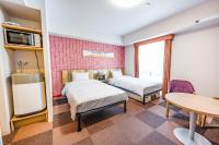 Tabino Hotel lit Matsumoto Milky white Onsen客房内的一张或多张床位