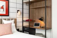 Hôtel Moderniste客房内的一张或多张床位