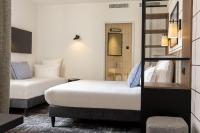 Hôtel Moderniste客房内的一张或多张床位