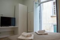 WANDERLUST NAPLES a place to stay客房内的一张或多张床位