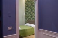 WANDERLUST NAPLES a place to stay客房内的一张或多张床位