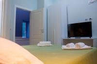 WANDERLUST NAPLES a place to stay客房内的一张或多张床位