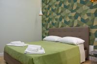 WANDERLUST NAPLES a place to stay客房内的一张或多张床位