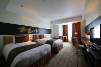 International Resort Hotel Yurakujo客房内的一张或多张床位