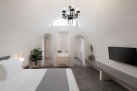 Occhio Luxury Villas Santorini with private pool客房内的一张或多张床位