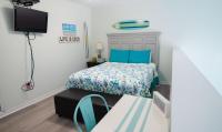 Grand Beach Resort Penthouse 1客房内的一张或多张床位