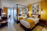 Allegro Hoi An . A Little Luxury Hotel & Spa客房内的一张或多张床位