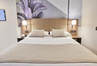 Riu Plaza Manhattan Times Square客房内的一张或多张床位