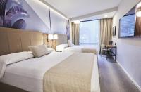 Riu Plaza Manhattan Times Square客房内的一张或多张床位