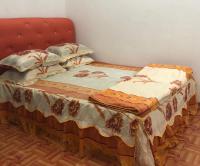 HOMESTAY CIK MUNAH客房内的一张或多张床位