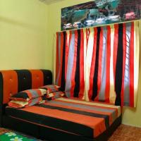 HOMESTAY CIK MUNAH客房内的一张或多张床位
