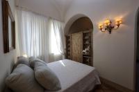 Casa Raiola Ercolano Luxury Rooms &amp; Spa客房内的一张或多张床位