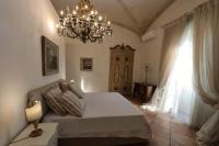 Casa Raiola Ercolano Luxury Rooms &amp; Spa客房内的一张或多张床位