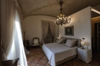 Casa Raiola Ercolano Luxury Rooms &amp; Spa客房内的一张或多张床位