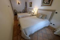 Casa Raiola Ercolano Luxury Rooms &amp; Spa客房内的一张或多张床位