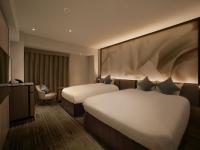 ORIENTAL HOTEL UNIVERSAL CITY客房内的一张或多张床位