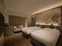 ORIENTAL HOTEL UNIVERSAL CITY客房内的一张或多张床位